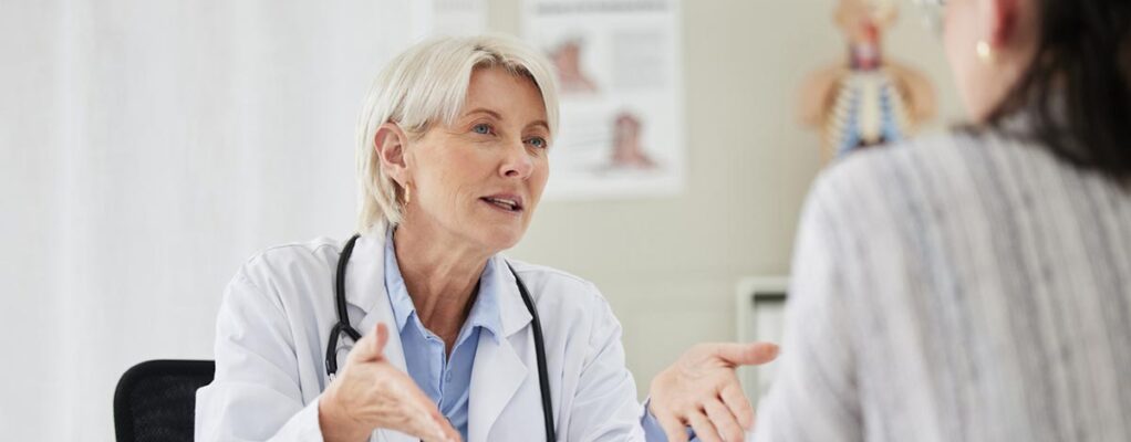 Doctor talking with young mesothelioma patient