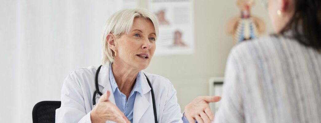 Doctor talking with young mesothelioma patient