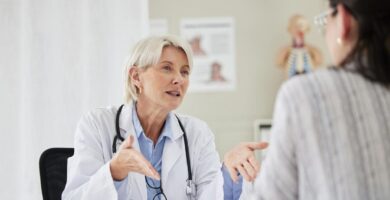 Doctor talking with young mesothelioma patient