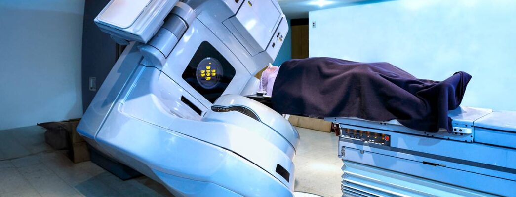 Patient lies on their back under a linear accelerator machine