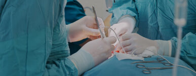 Close-up of two surgeons operating on a patient