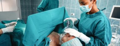 Elderly male patient getting prepared for surgery in an operating room
