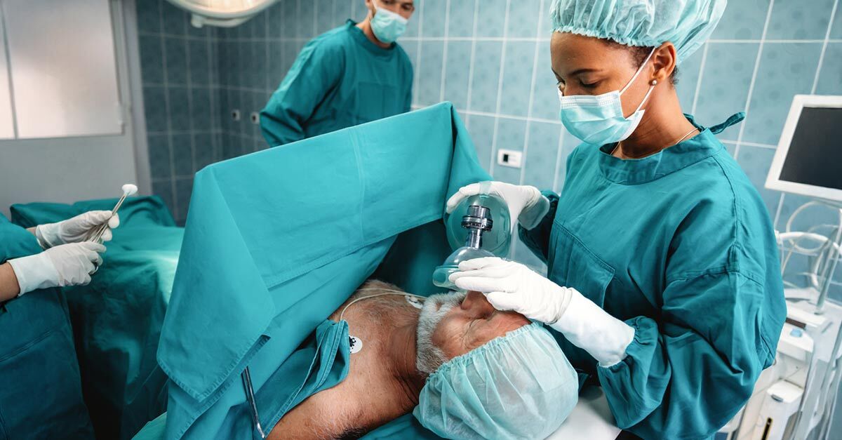 Elderly male patient getting prepared for surgery in an operating room